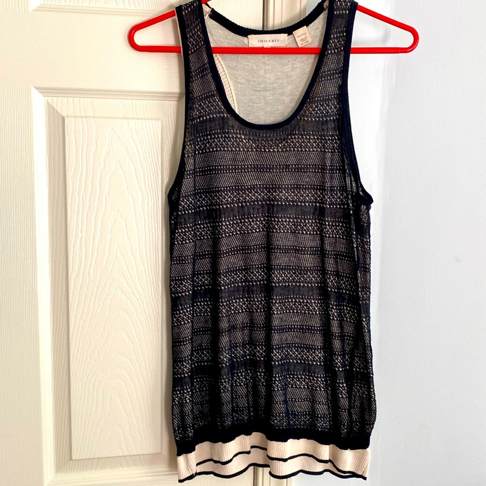 100% cotton vest. Very comfortable and feels like 2nd skin.